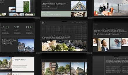 Multiple laptop and screen mockups displaying a dark mode corporate website design with typography and architectural photography.
