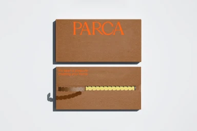 Two brown textured rectangular boxes featuring orange typography and a zipper mechanism on a white background