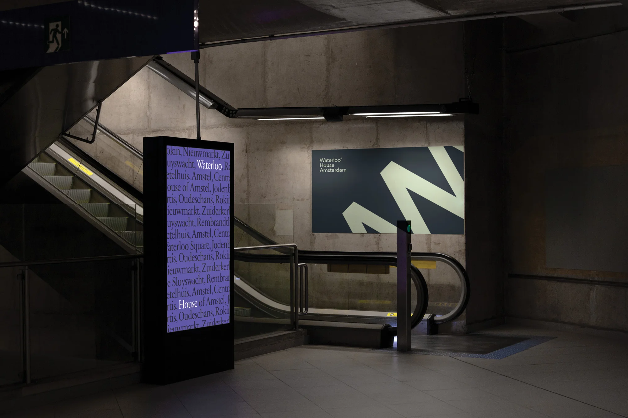 An indoor shot of an escalator and a digital sign displaying text, set against a concrete wall with a large poster.