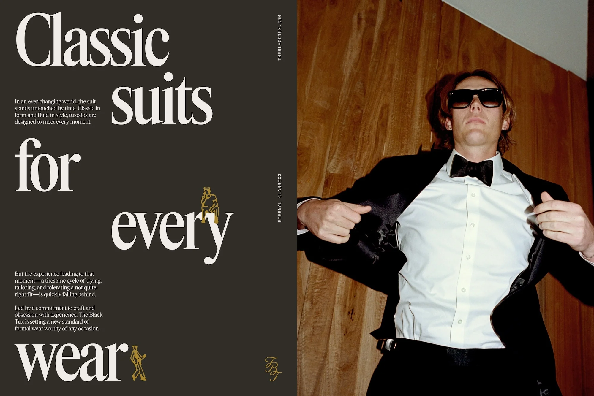 Man poses in tuxedo against wood wall, showcasing formalwear. Sharp lines, classic style. Website ad for The Black Tux.