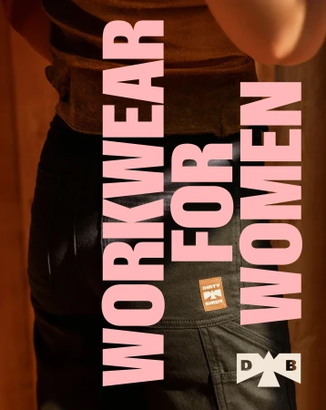 Torso shot of an adult wearing dark green work pants with pink 'Workwear for Women' text overlay, focusing on the pants and a brand patch.