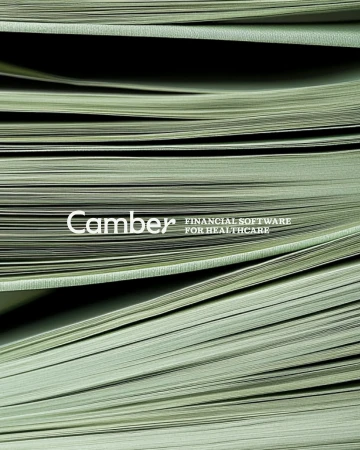 Stack of financial software brochures for healthcare, featuring the 'Camber' logo, arranged in a textured, layered display. 