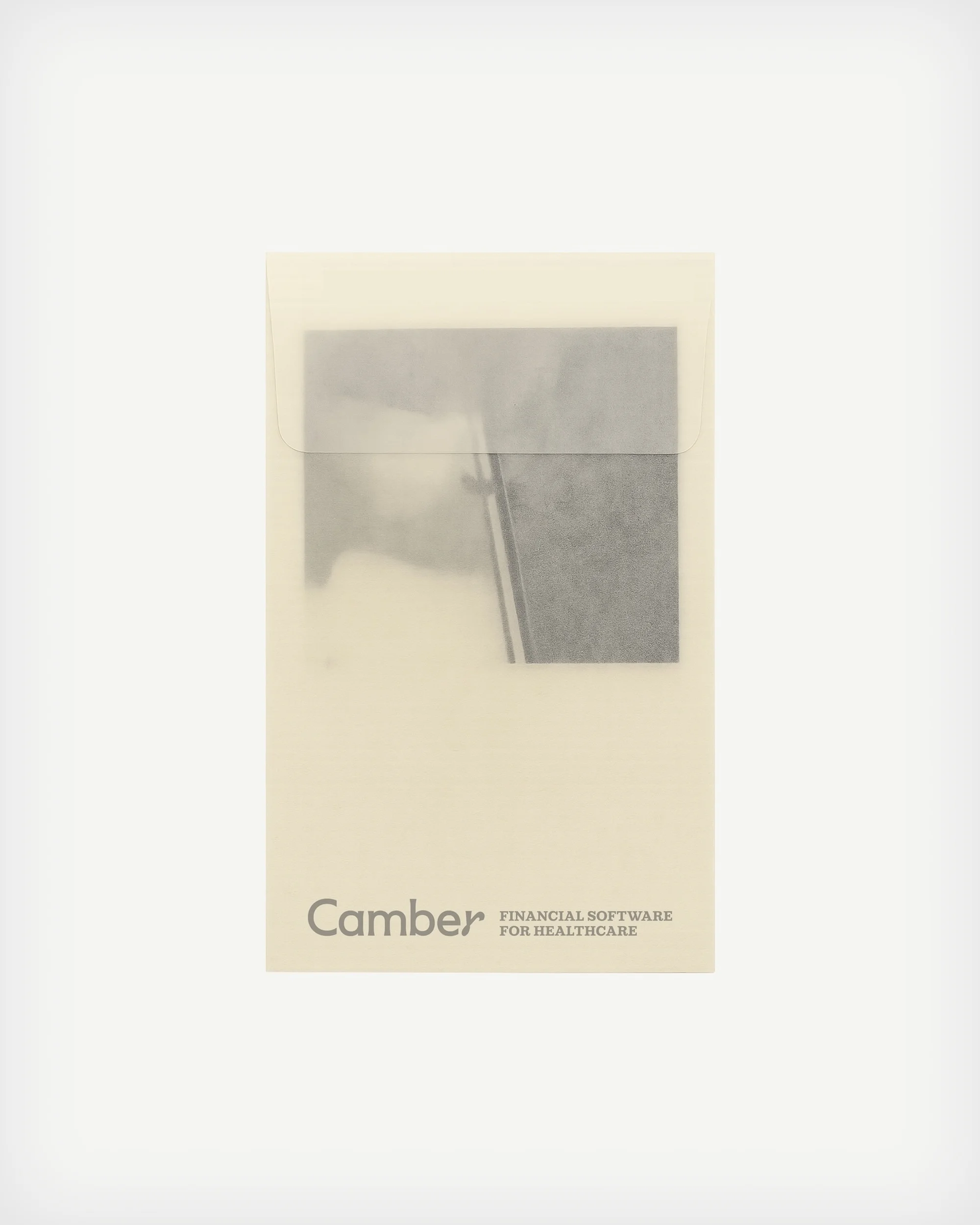 Minimalist image of a product folder with the words 'Camber FINANCIAL SOFTWARE FOR HEALTHCARE' on a solid white background.