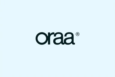 Oraa brand identity logo featuring custom dark lettering centered on a solid light blue background.