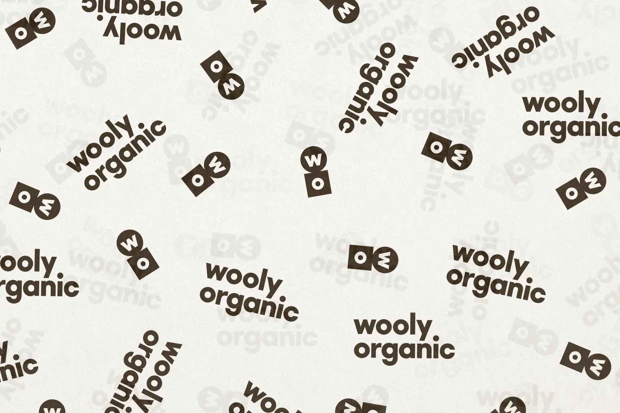 Scattered logos of 'wooly organic' against a light beige background create a visually repeating branded pattern.