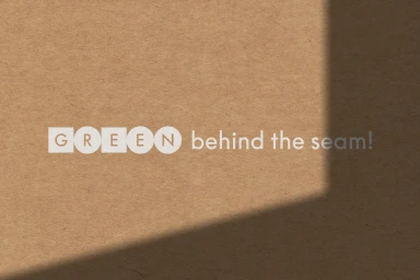 White typographic logo reading Green behind the seam on a textured brown kraft paper background with a diagonal shadow.