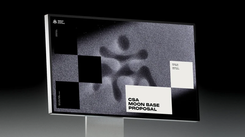 Digital display shows CSA Moon Base Proposal with a grey textured background, black and white checkered pattern, and white text.