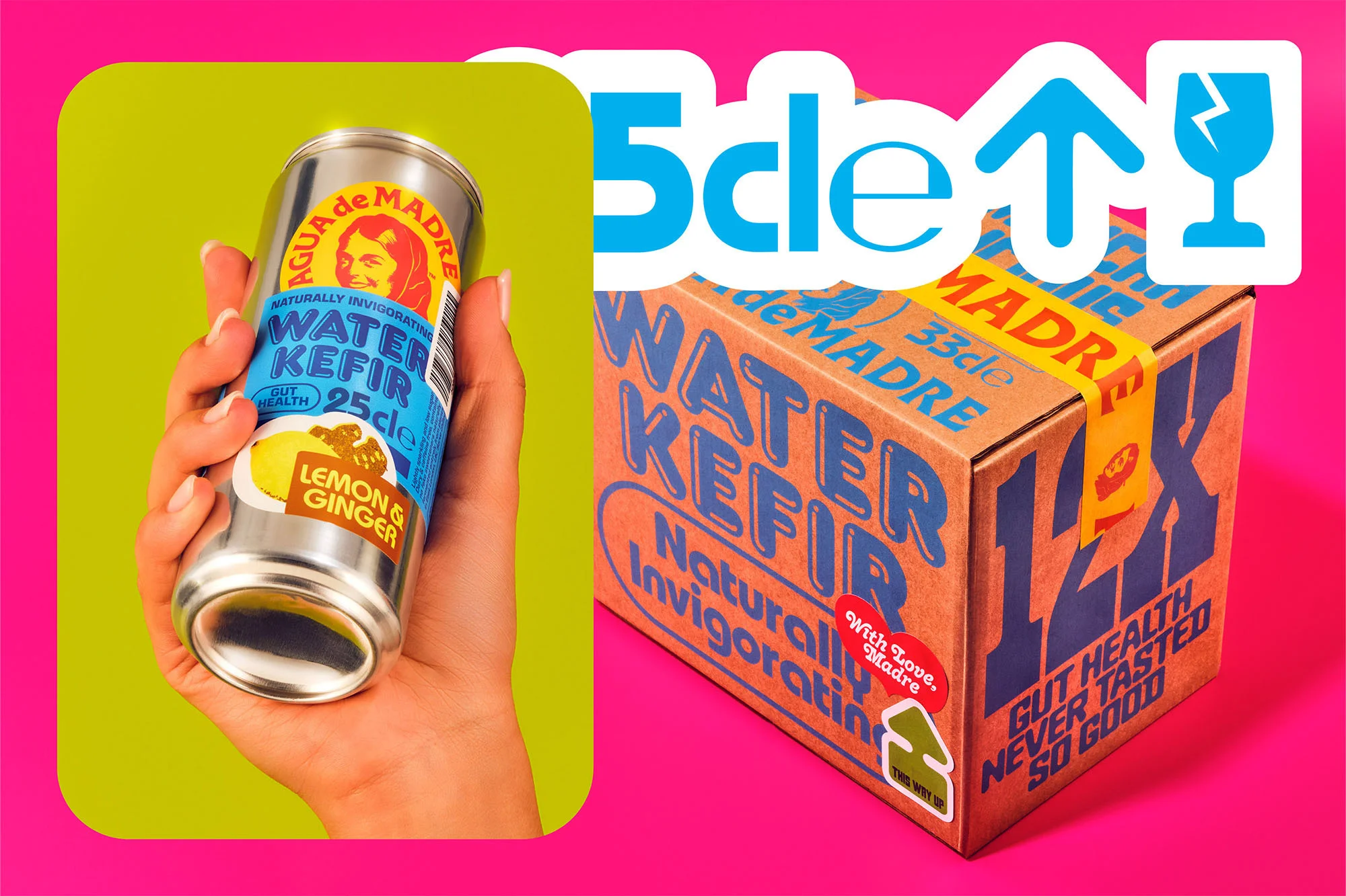 Close-up of hand holding Agua de Madre water kefir can against a two-tone background with shipping box and brand graphics.