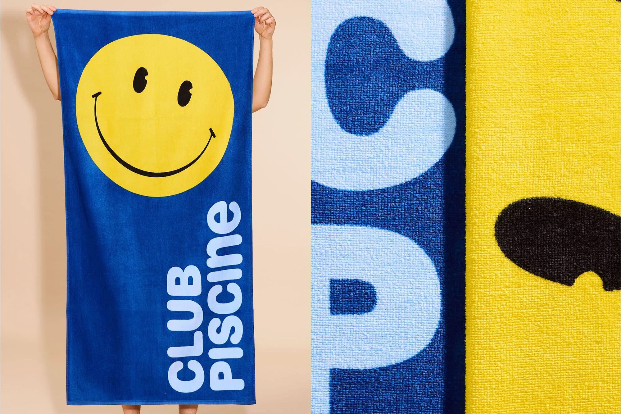 Blue and yellow towel featuring a smiley face and the text 'CLUB Piscine' being held up indoors, close-up.