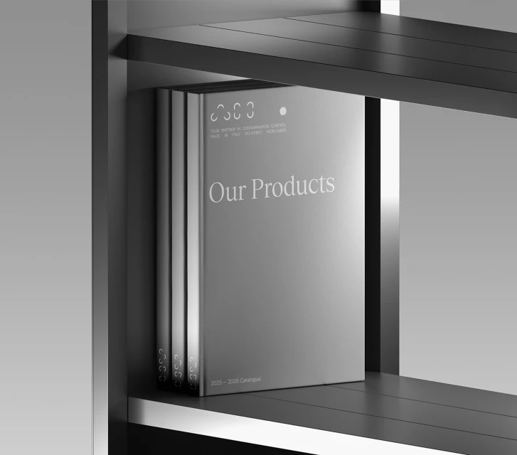 Studio shot of three product catalogs on a dark shelf, featuring a grayscale color palette and clean, modern design.