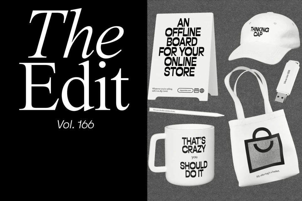 White shopping and advertising objects including a tote bag, mug, baseball cap, USB drive, sign, and pen arranged on a gray background.