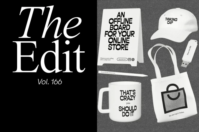 White shopping and advertising objects including a tote bag, mug, baseball cap, USB drive, sign, and pen arranged on a gray background.