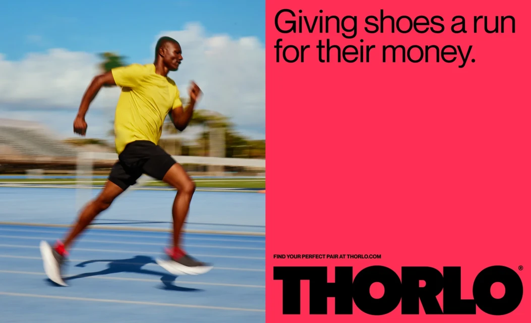 Athletic man running on a blue track in a sports advertisement with text, wearing a yellow t-shirt, shorts, and running shoes.
