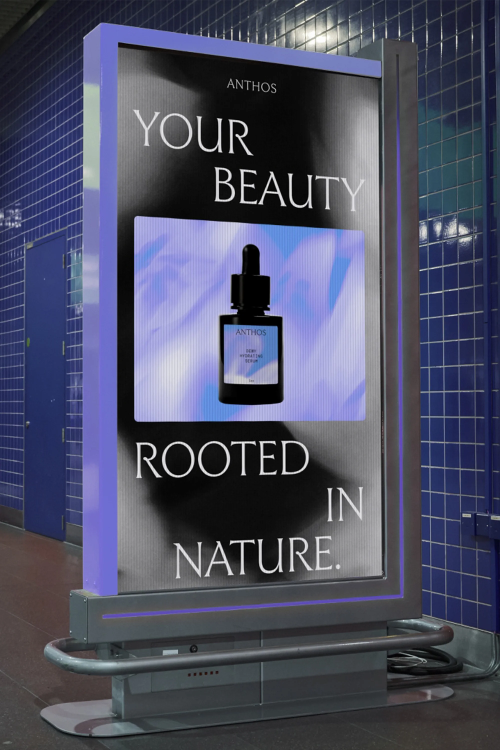 Digital billboard in a subway station displays an ad for Anthos beauty products. The background shows the tiled walls of the station.