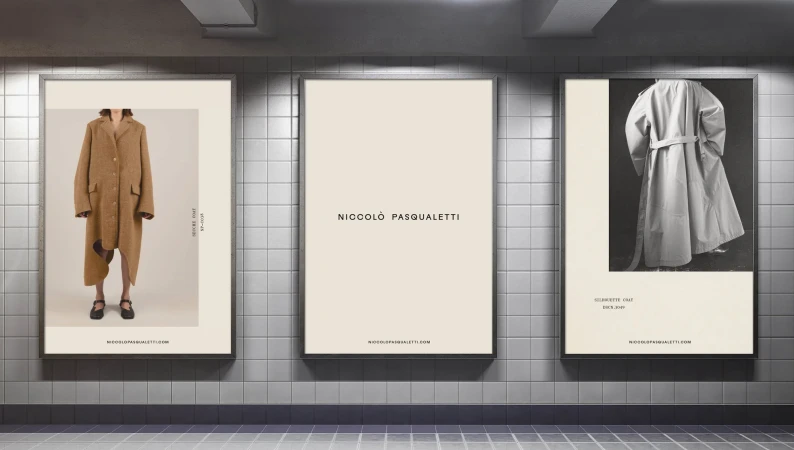 Three vertical posters featuring Niccolo Pasqualetti brand identity displayed on a tiled subway wall