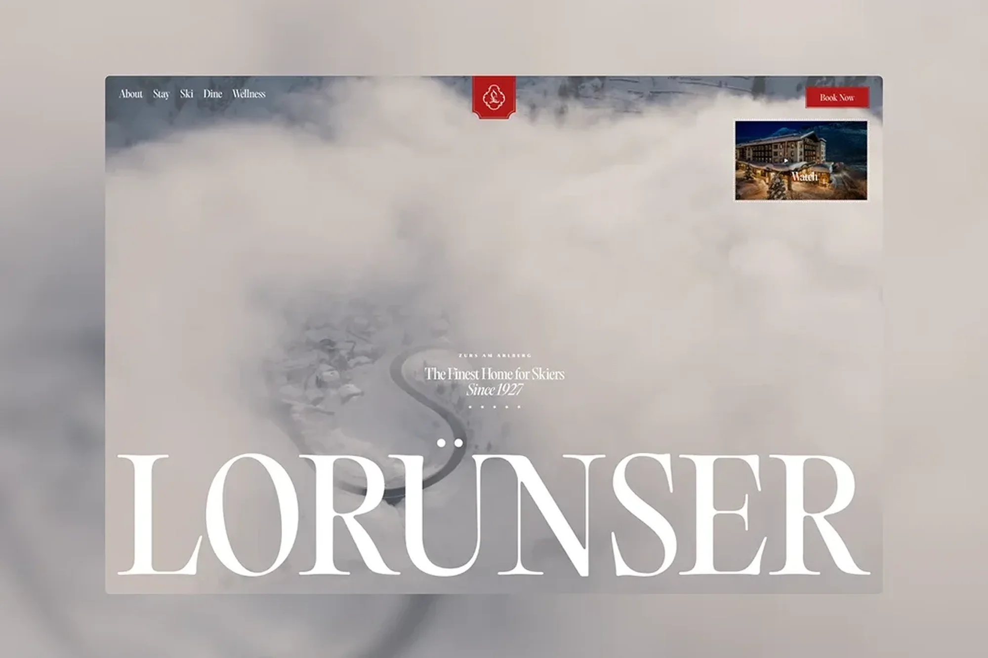 Hotel website design featuring snowy mountain scenery, modern typography, and a glimpse of the alpine resort's cozy nighttime ambiance.
