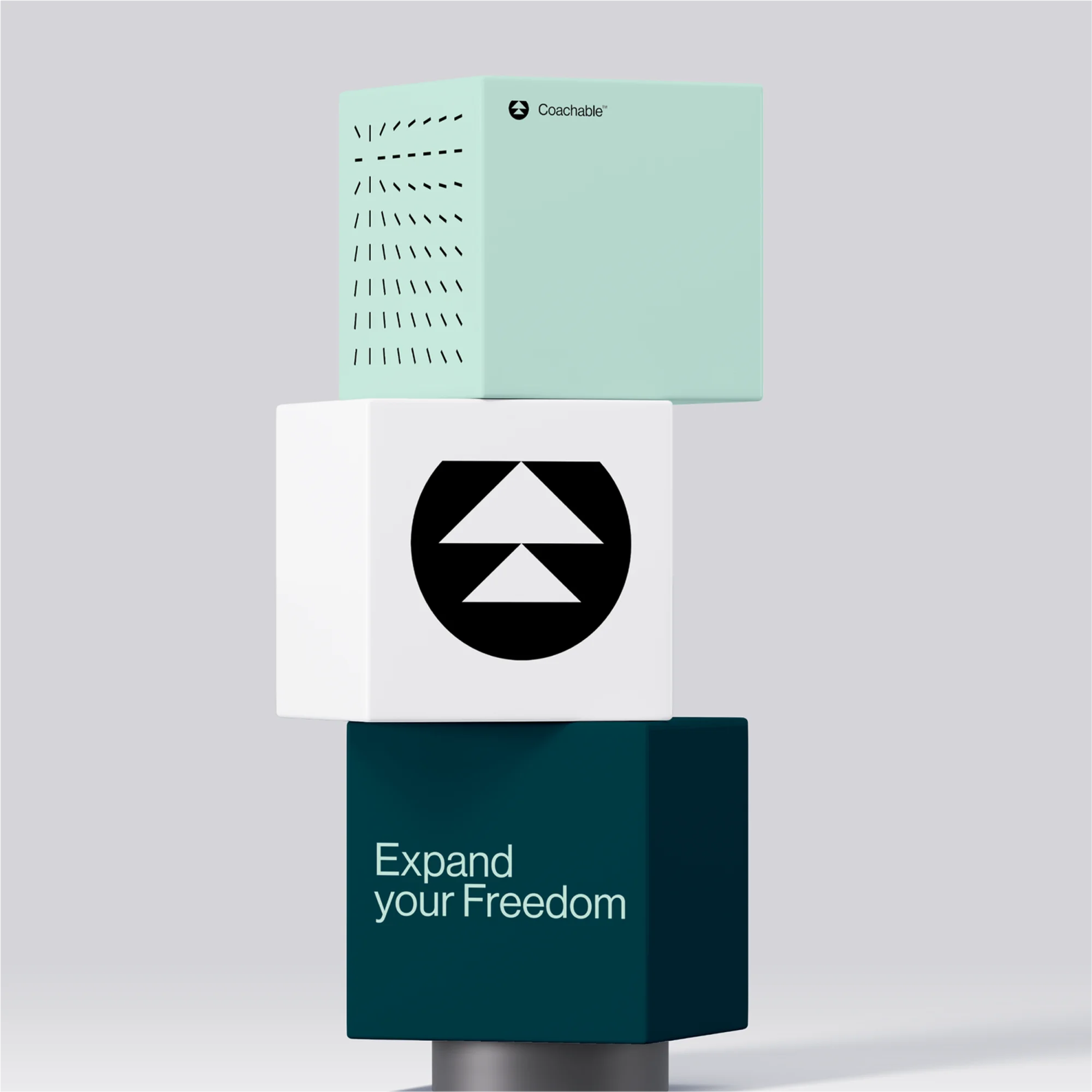Stacked cubes with geometric patterns and text 'Expand Your Freedom'. Modern, minimalist design with teal, white, and dark green colors.