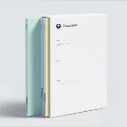 White slipcase binder featuring the Coachable brand logo with three pastel-colored books sliding out.