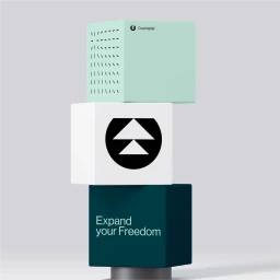 Stacked cubic blocks in mint green, white, and dark teal displaying minimalist graphic branding against a neutral background.