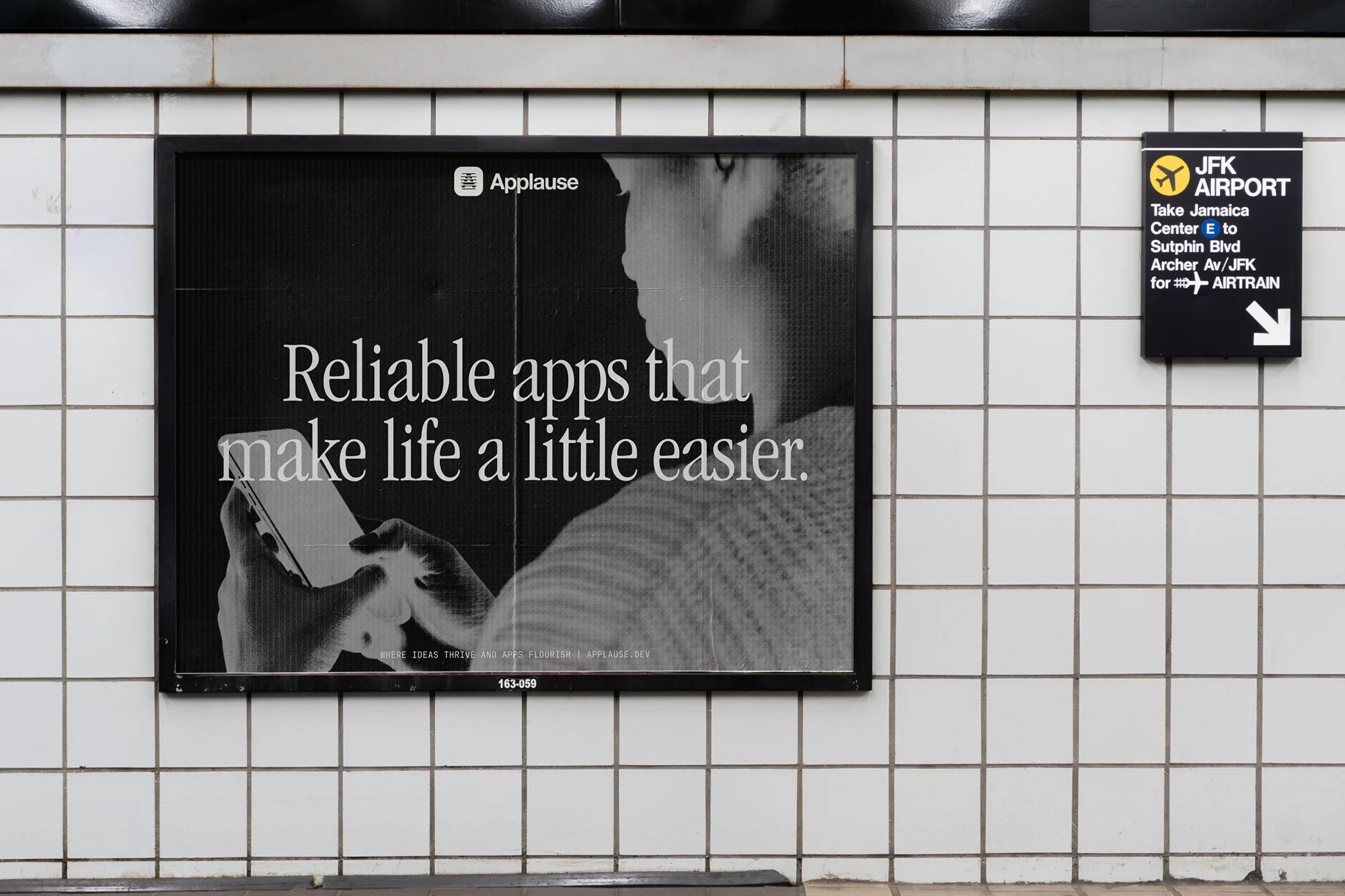 Subway platform displays an ad for 'Applause' featuring a person using a smartphone, alongside a JFK Airport direction sign.