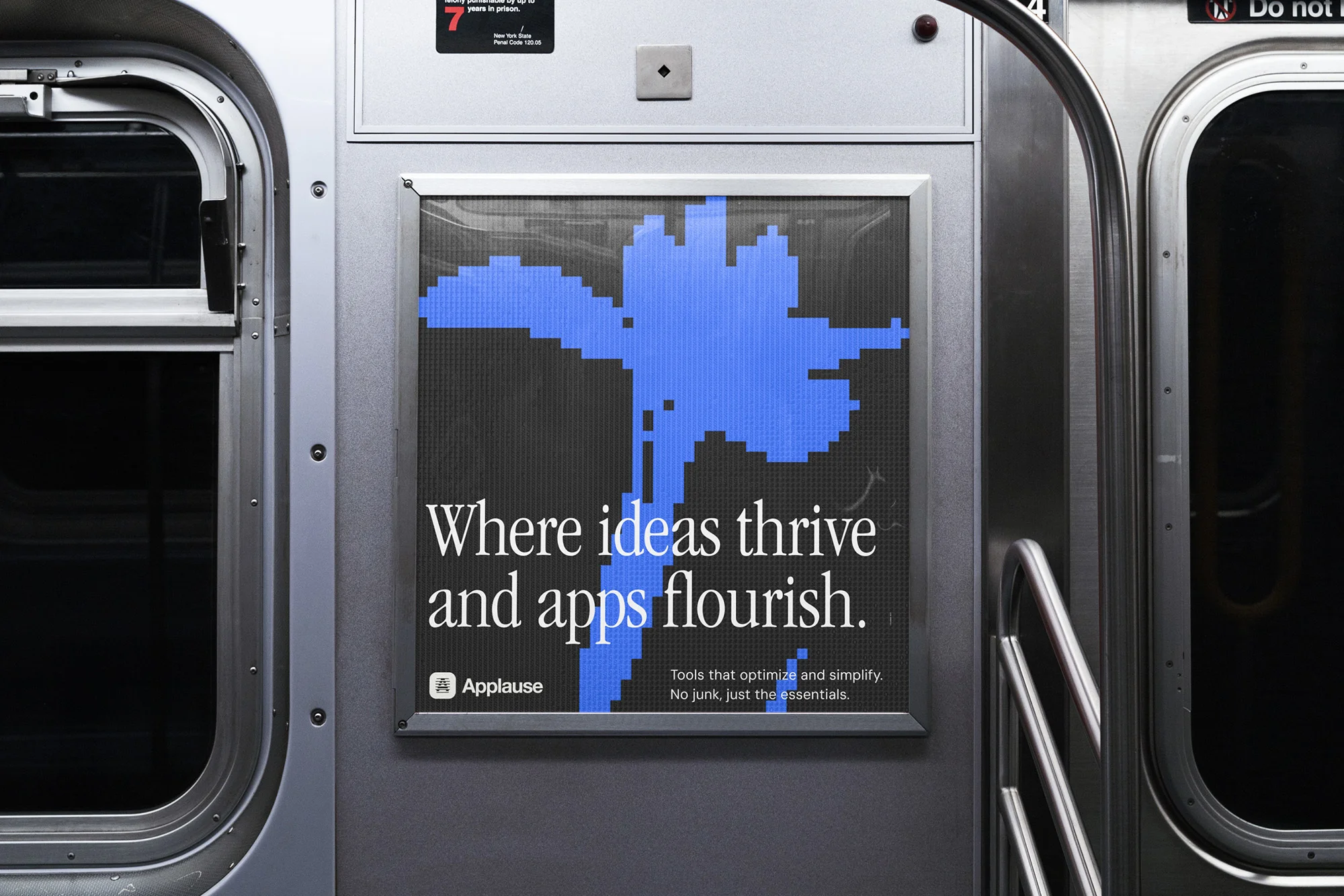 Advertisement inside subway car featuring graphic flower, text 'Where ideas thrive and apps flourish,' and the logo for 'Applause'.