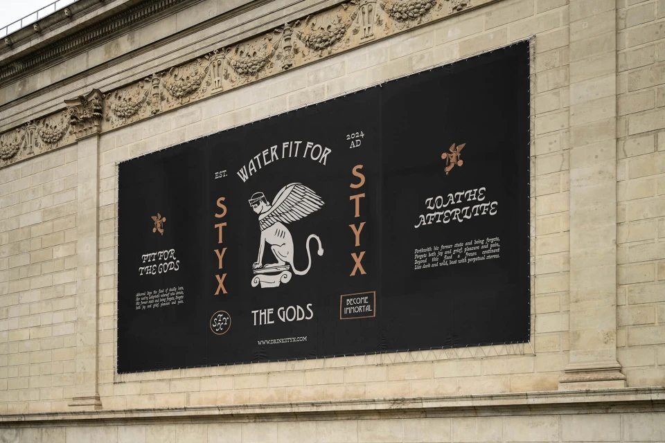 Outdoor banner featuring a white illustration of a winged cat sphinx on a black background, promoting 'Water Fit For Styx'.
