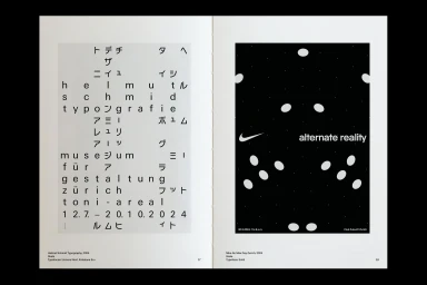 Spreading pages of a publication displaying bold typography and graphic black and white layout designs