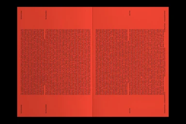 Spread of a publication featuring dense columns of black typography printed on vibrant red paper pages.