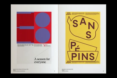 Open book showing two editorial spreads with bold geometric shapes, typography, and vibrant red, yellow, and purple colour blocks.