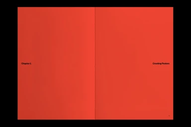 Open publication pages with solid bright red backgrounds and minimal black typography showing Chapter 1 and Creating Posters.