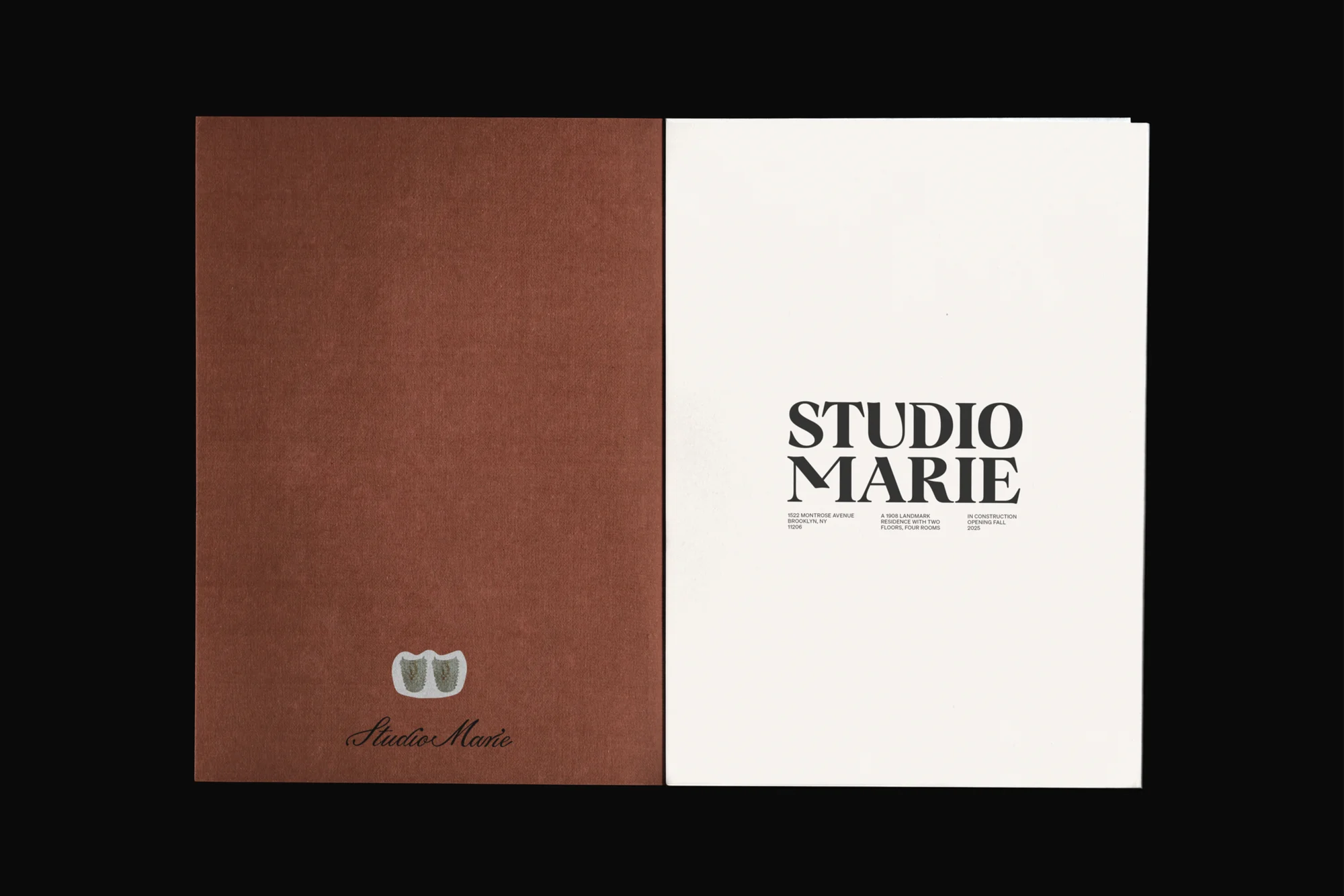 Open brochure featuring a solid brown textured cover on the left and a white page with bold Studio Marie typography on the right