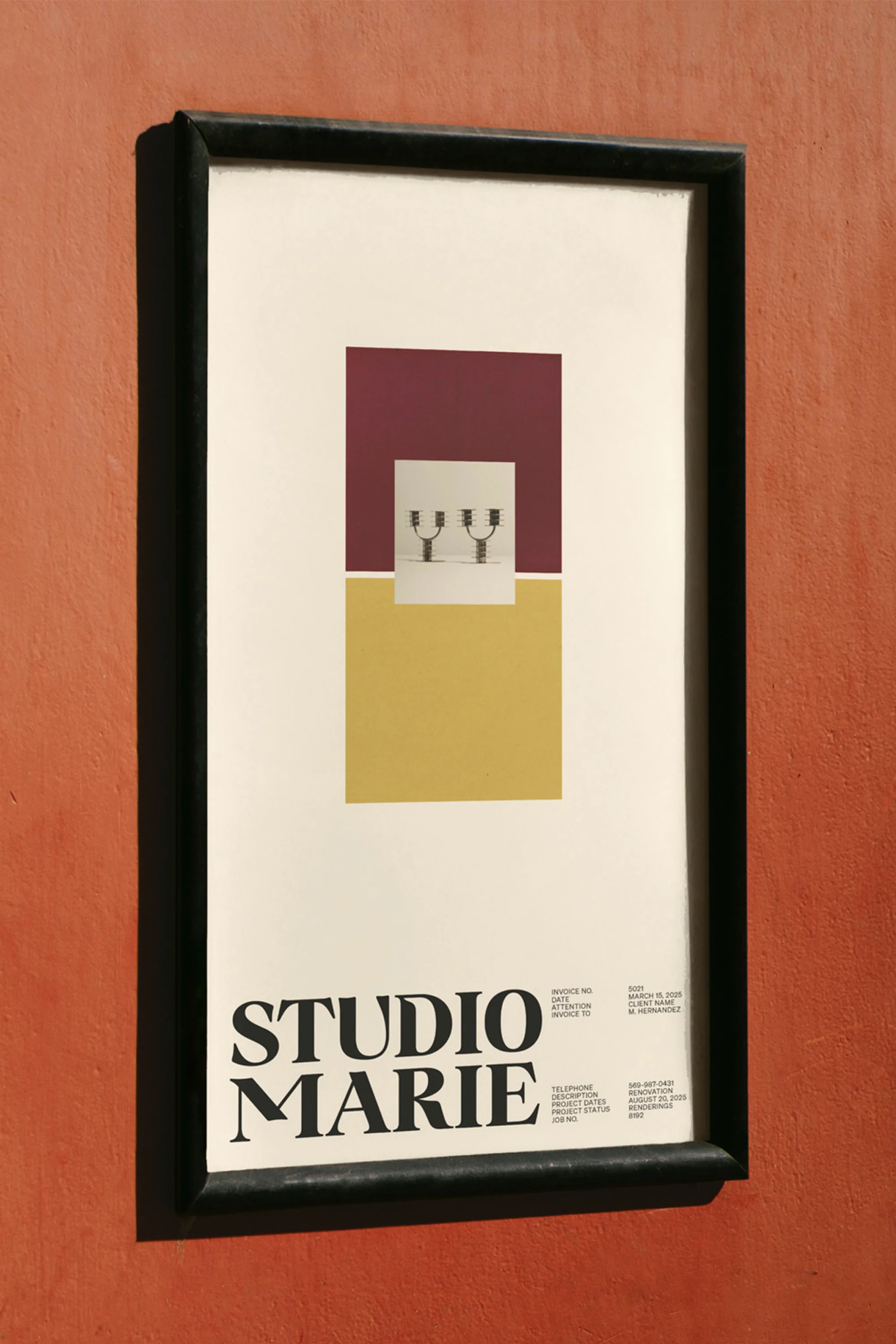 Framed art print with geometric shapes, including a burgundy square, yellow rectangle, and pair of objects, hanging on an orange wall.