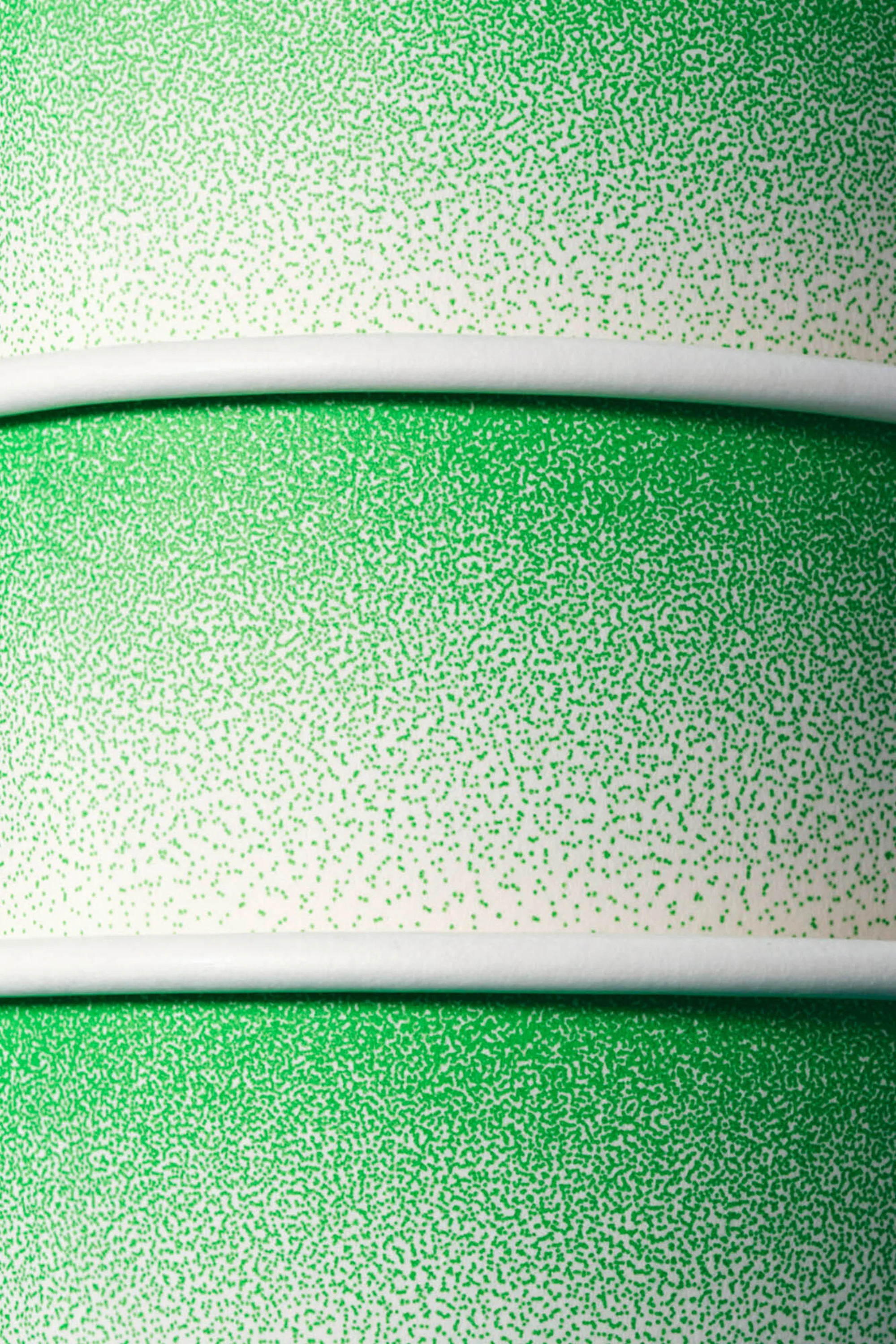 Abstract image of green and white color gradient pattern divided by horizontal white stripes, creating a textured background effect.
