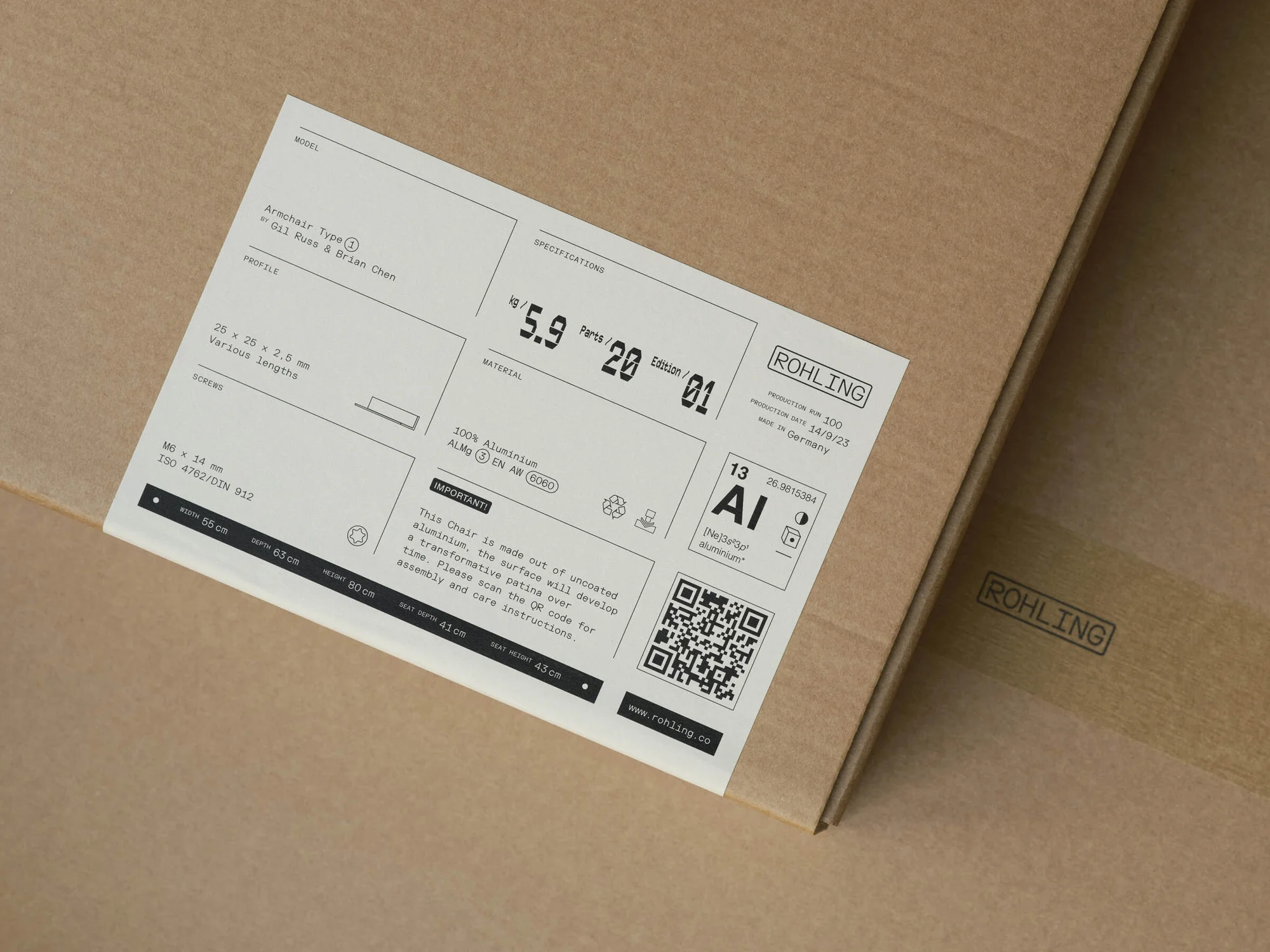 Close-up of a cardboard box with a product label featuring information about an armchair, material specifications, and a Rohling logo.