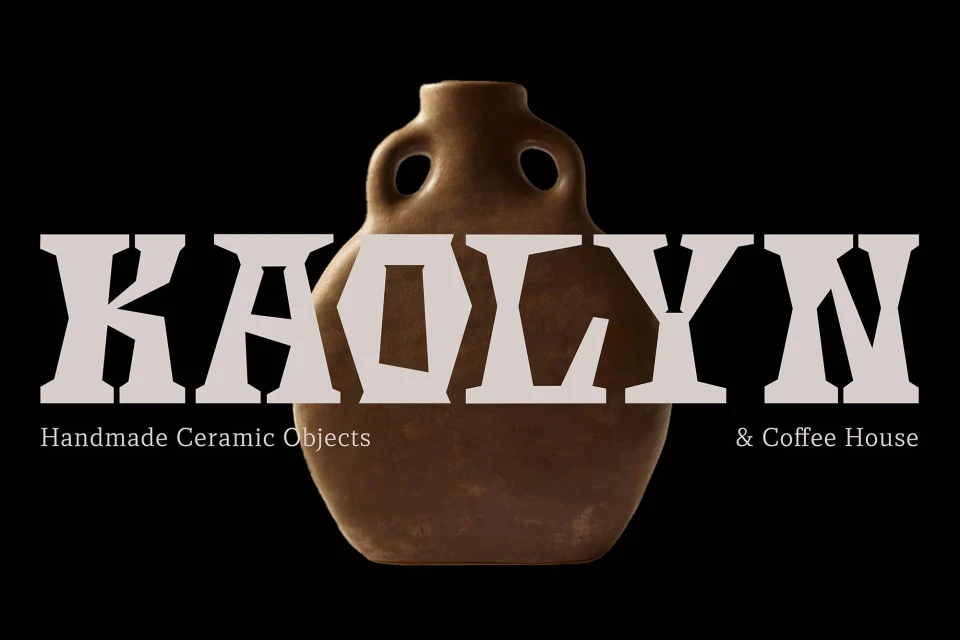Earthenware jug with two small handles set against a black background with text overlay for a cafe and ceramic object shop.
