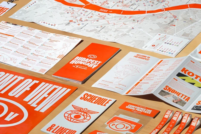 POV Budapest promotional material, including a map, brochures, and schedule, all featuring a consistent orange and white color scheme.