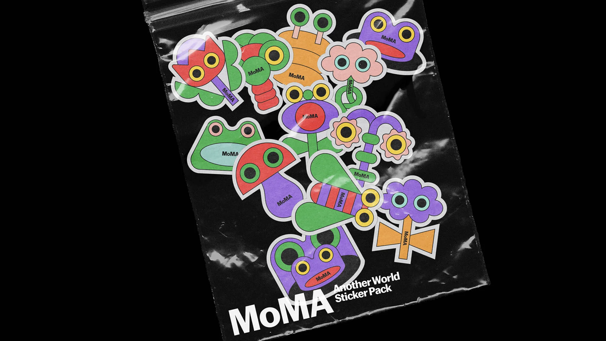 A plastic bag filled with colorful MoMA Another World sticker pack featuring cartoon frogs, mushrooms, flowers, and insect illustrations.