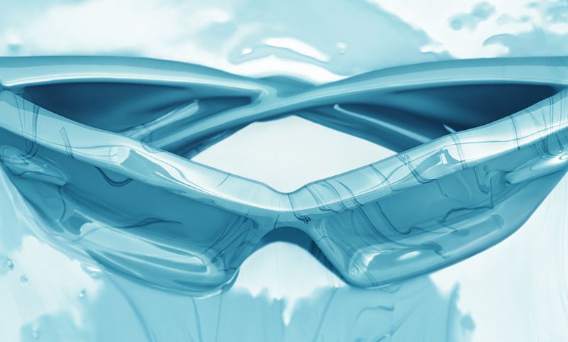 Close-up studio shot of blue translucent goggles, showcasing their unique design and material in a bright, minimalist setting.
