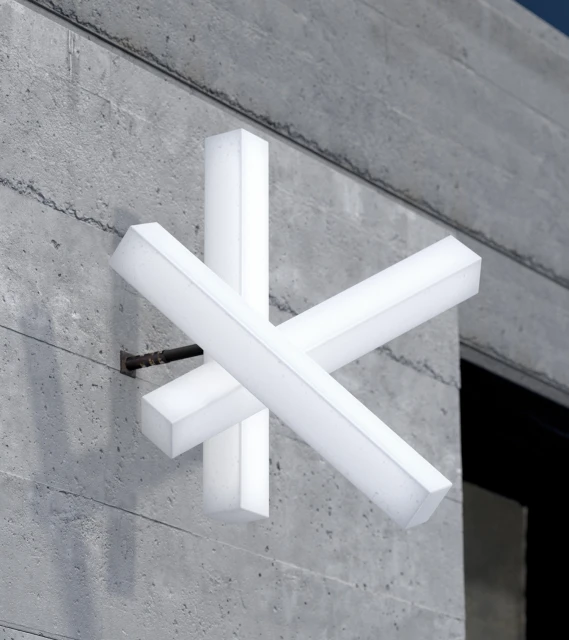 Modern abstract art installation featuring illuminated rectangular blocks mounted on a textured concrete wall, contemporary design.
