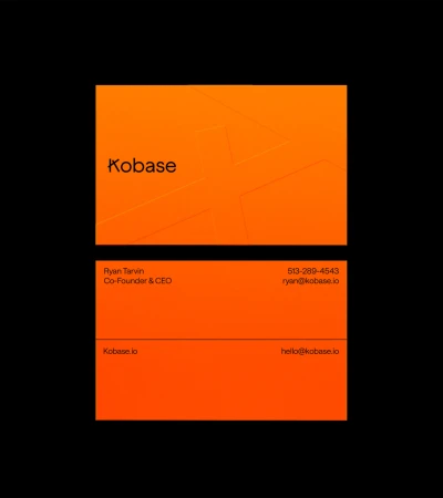 Two orange business cards, one on top of the other, displayed against a black background. Company branding and contact information.