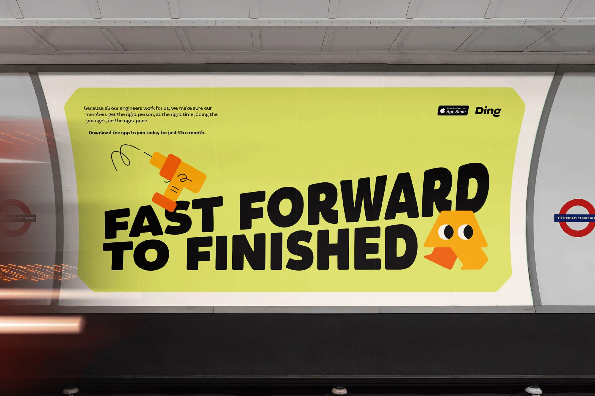Eye-level shot of an advertisement in the London Underground featuring large text and cartoon graphics, promoting a job application.