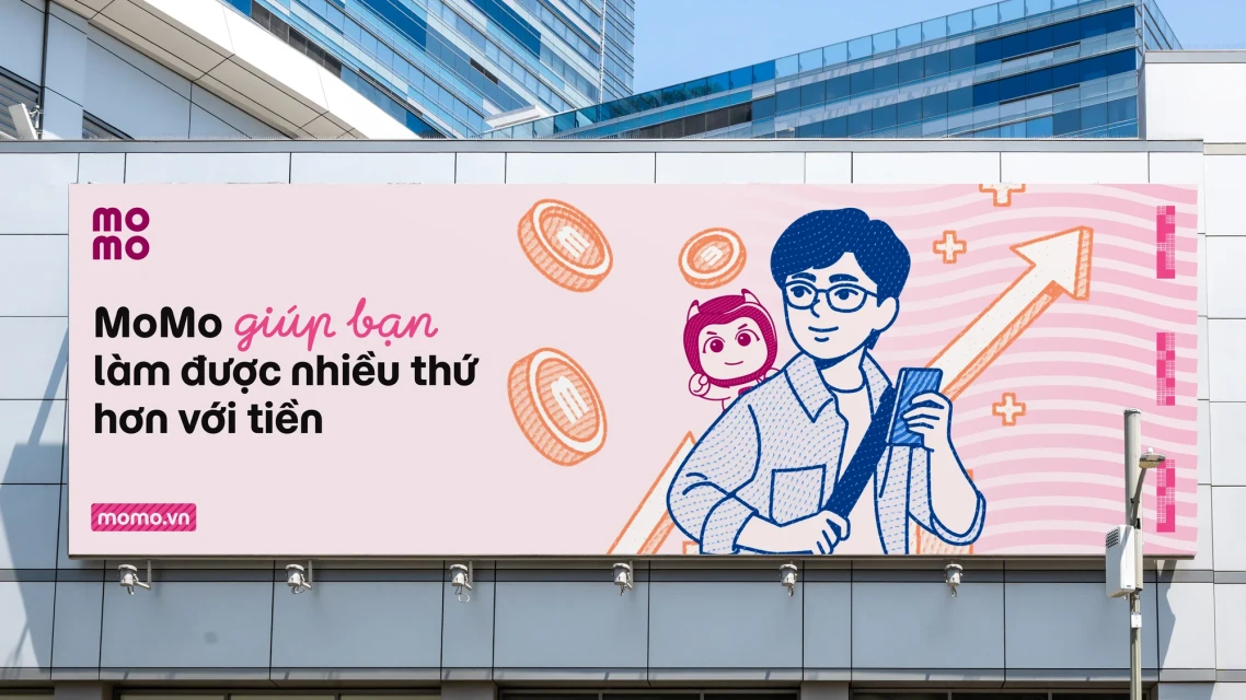 Billboard advertisement for MoMo featuring an illustration of a smiling man and a cartoon mascot in front of a city building.