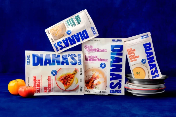 Diana's Seafood product pouches featuring clam chowder, sea bass, salmon skewers, and lobster bisque on a blue surface.