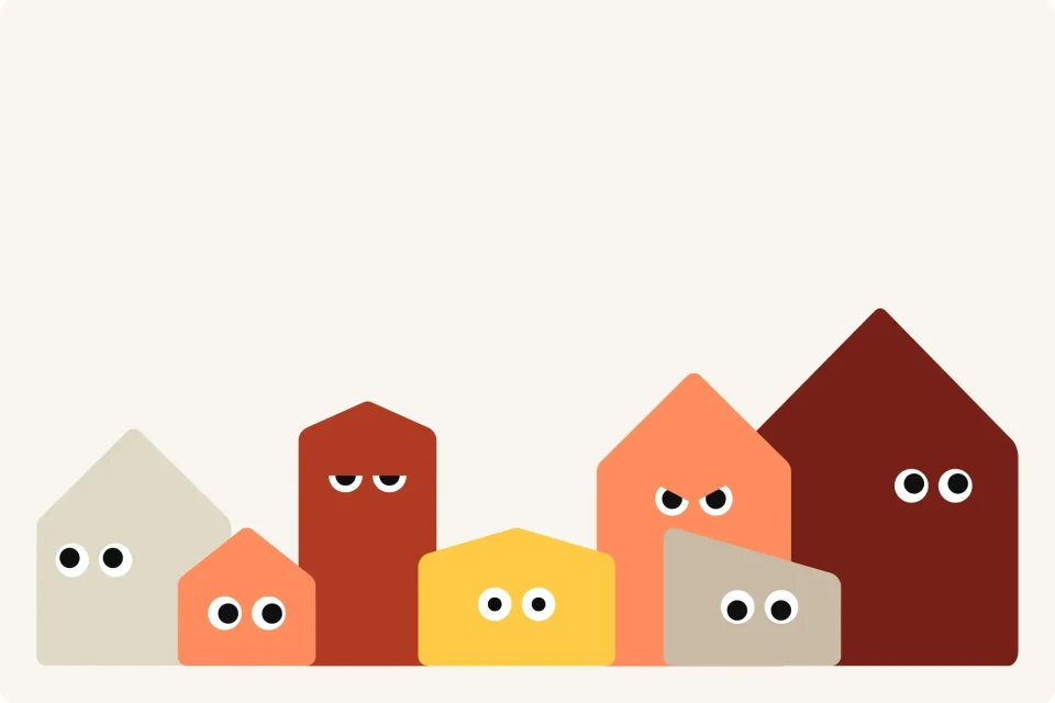 Animated colourful row of geometric house shapes with eyes on a white background, creating a playful, quirky neighbourhood illustration.