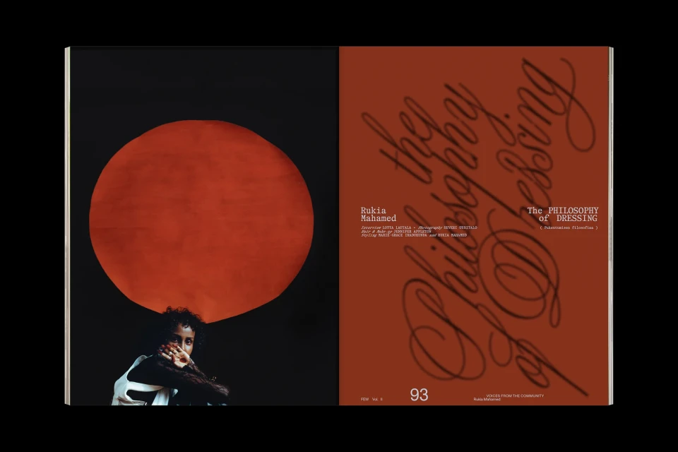 Magazine spread featuring portrait of Rukia Mahaned against a red sun and black background, with design details and text on opposite page.