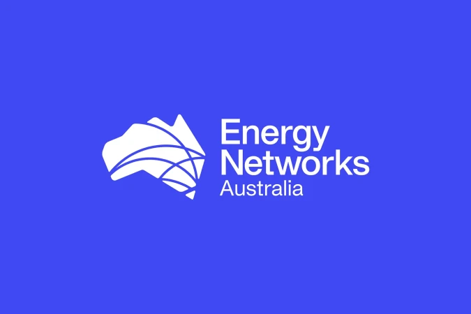 Energy Networks Australia logo on a blue background featuring a stylized white map of Australia with curved lines representing energy networks.
