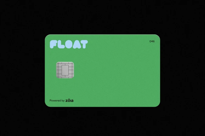 Close-up of a bright green credit card with blue lettering and a visible chip set against a stark black background.