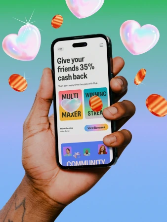 Close-up of a dark-skinned adult hand holding a smartphone. The screen displays a promotion offering cash back. Hearts float in the background.