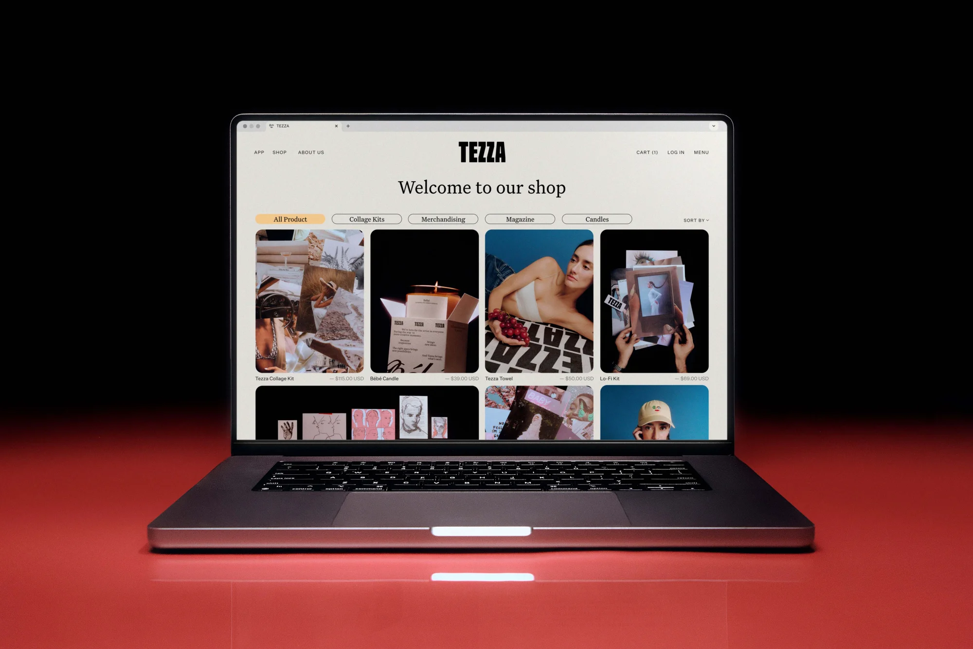 Laptop displaying an e-commerce website with various product categories against a dark backdrop, sleek design, and vibrant colors.