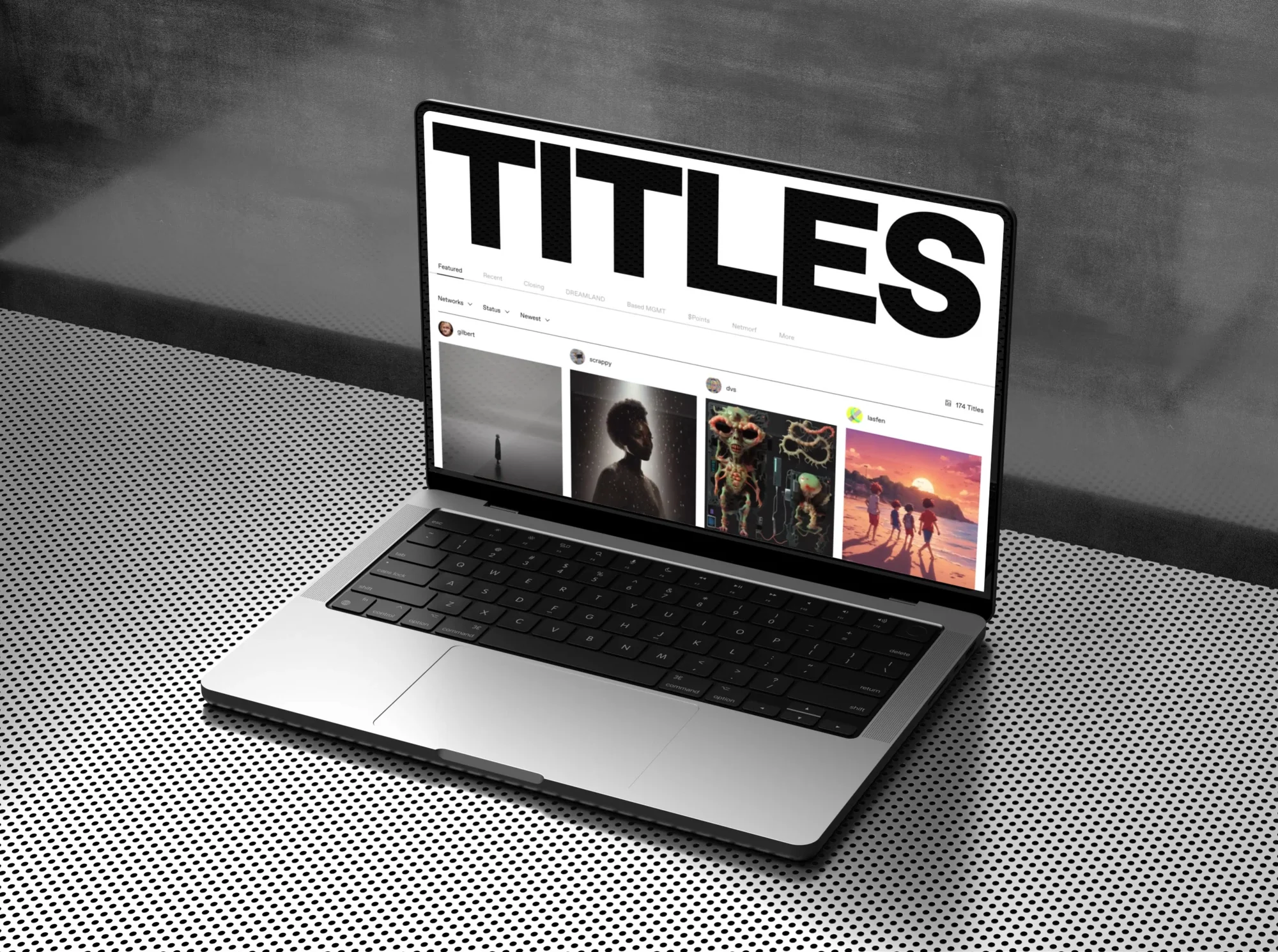 Silver laptop displays website titles on a black dotted table against a grey wall, showcasing digital design and modern technology.